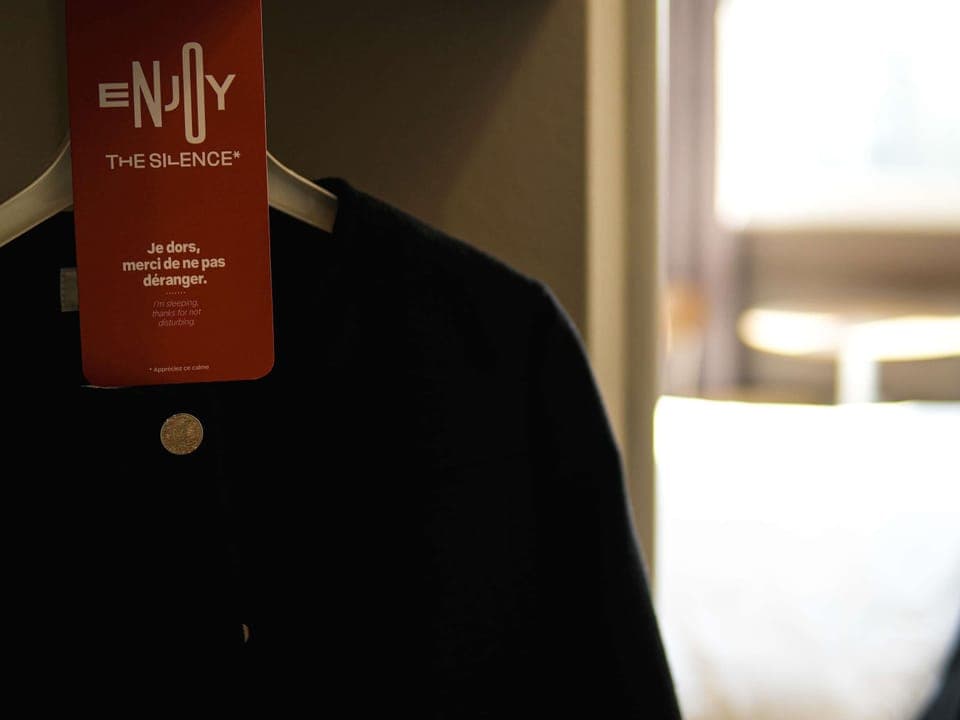 Premium bedding, desk, laptop workspace, blackout drapes