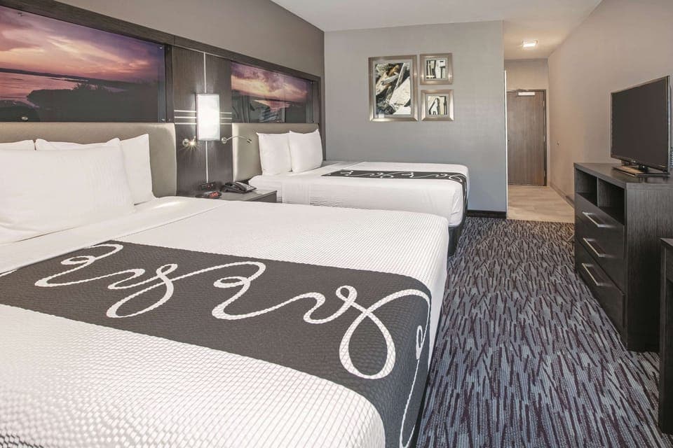 Room, 2 Queen Beds, Non Smoking | Pillowtop beds, desk, iron/ironing board, free cribs/infant beds