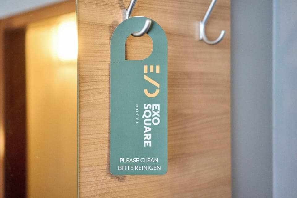 Hypo-allergenic bedding, desk, laptop workspace, blackout drapes