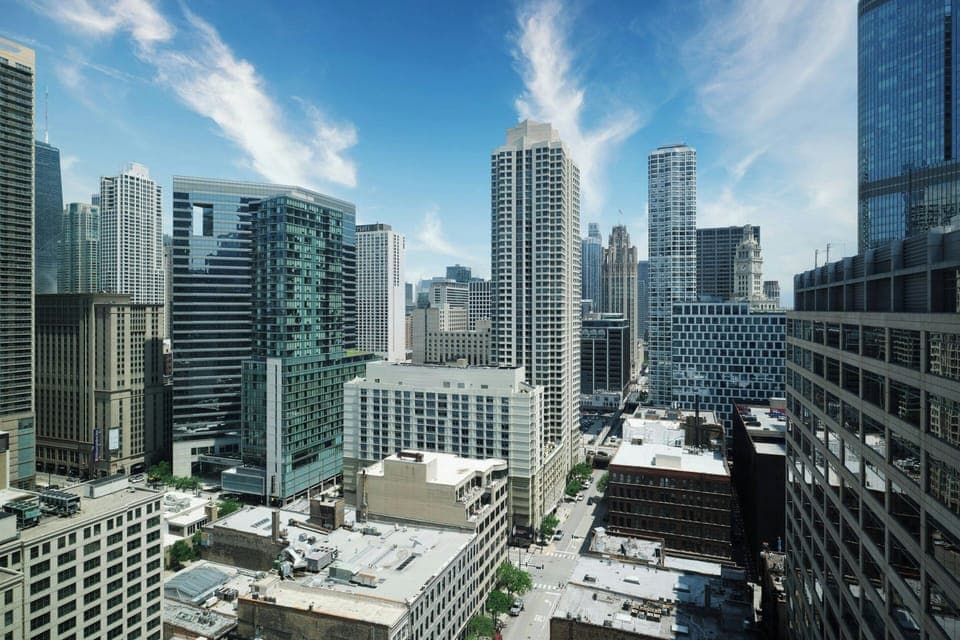 Premium bedding, desk, laptop workspace, blackout drapes