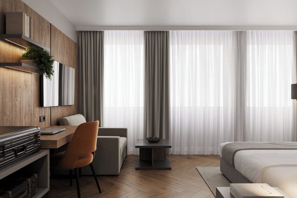 Deluxe Room | Minibar, desk, laptop workspace, blackout drapes