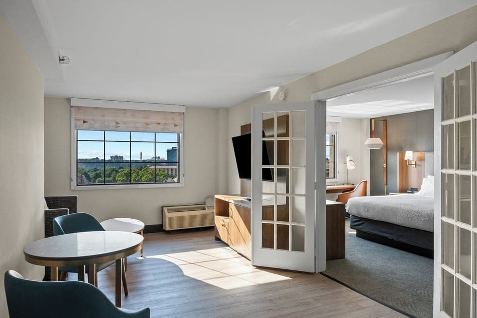 Suite, 1 King Bed (Canadian Skyline View) | Desk, laptop workspace, blackout drapes, iron/ironing board