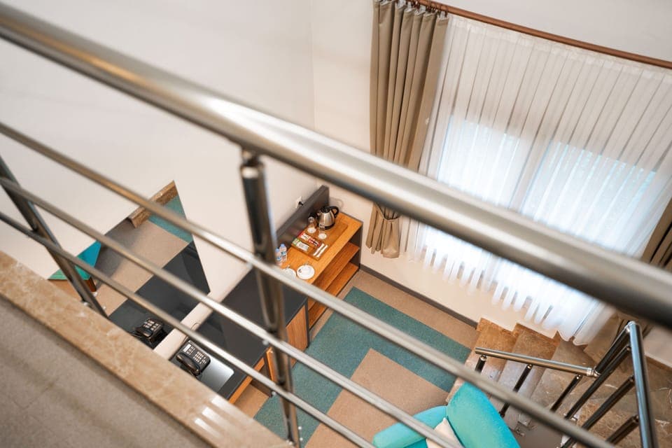 Deluxe Duplex | Minibar, in-room safe, desk, soundproofing