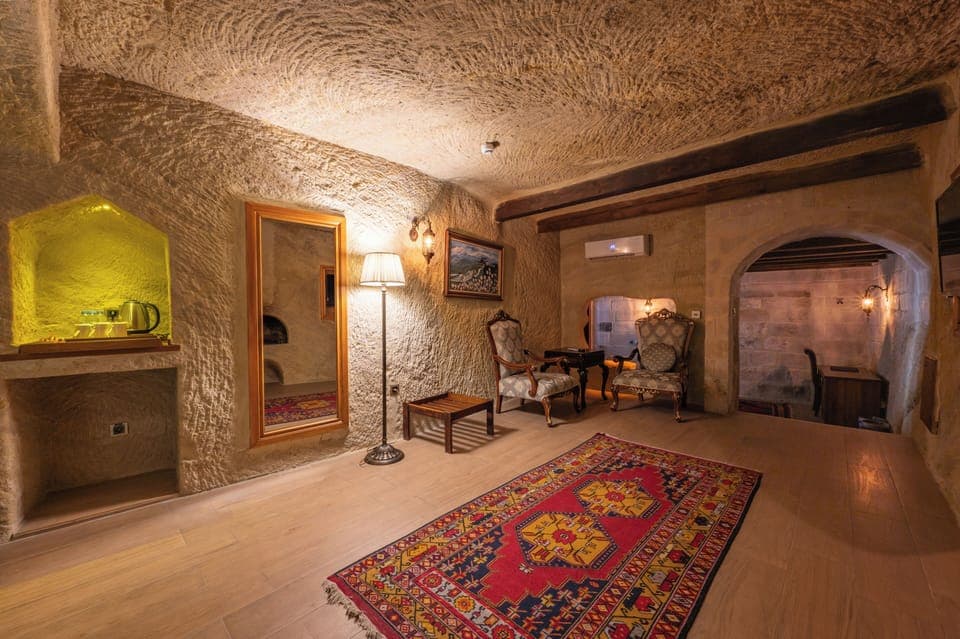 Executive Suite, Fireplace | Living area | LED TV, heated floors