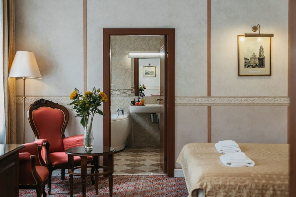 Desk, laptop workspace, blackout drapes, iron/ironing board