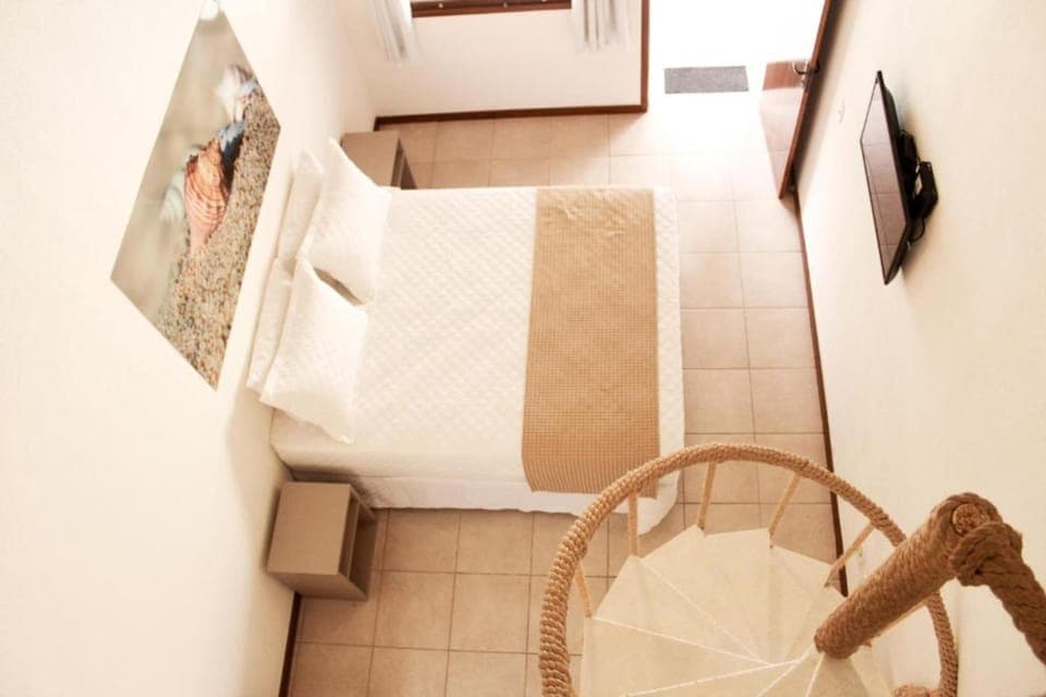 Standard Quadruple Room | Minibar, in-room safe, iron/ironing board, bed sheets