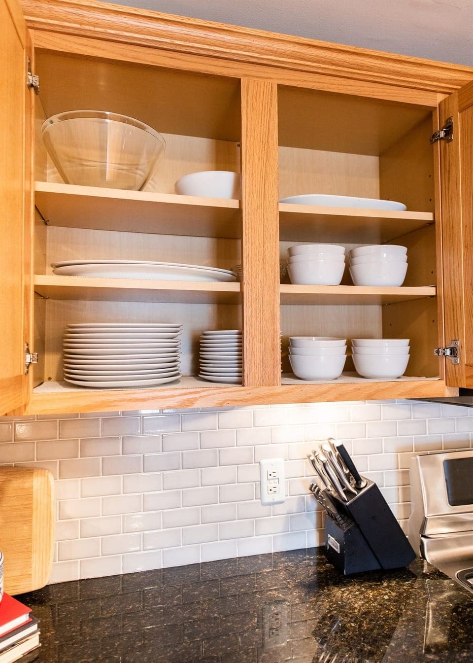 Upscale appliances with dual ovens, refrigerator with water in the door, microwave, dishwasher, and Keurig Duo. Includes all dishes and glassware with seating for 6.