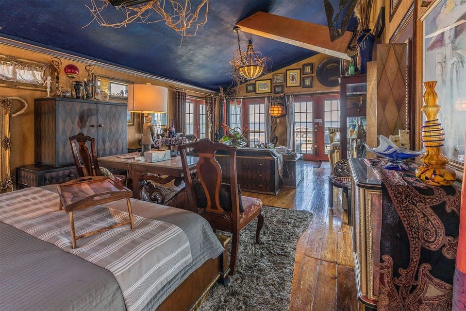 View from entryway, overlooking King Tempurpedic Bed and two person Jacuzzi Tub 