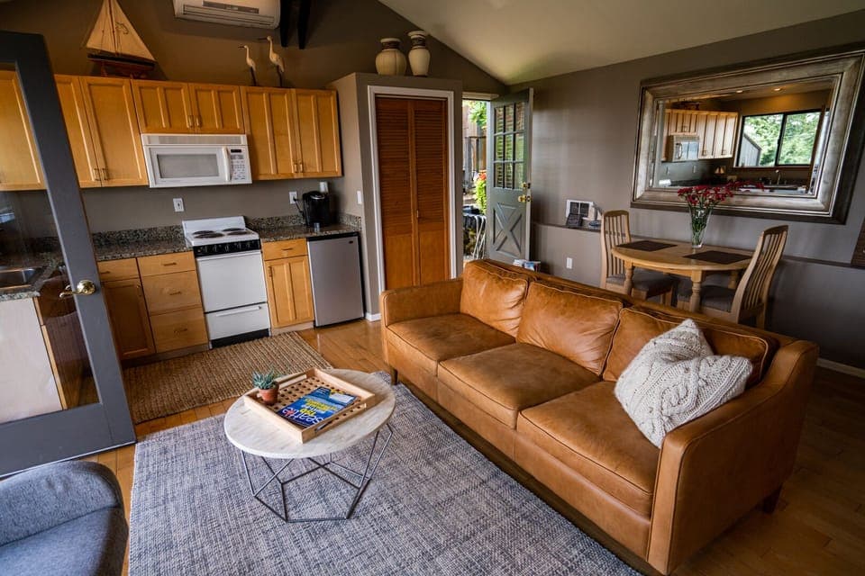 Simple decor with a cozy comfortable leather couch.  