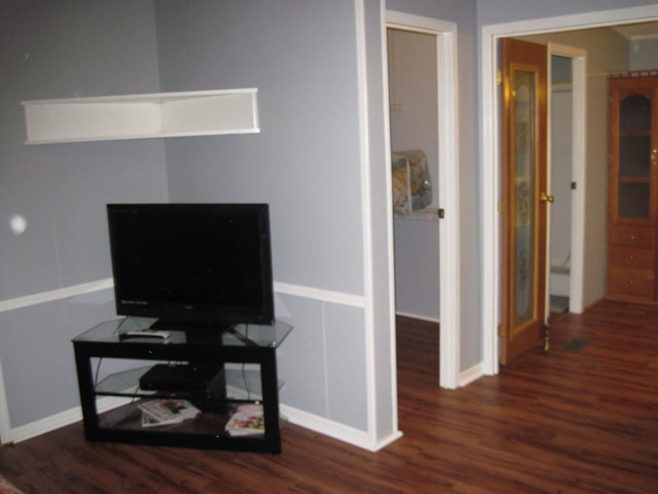 Master bedroom. TV and large walk in closet. Just ahead is master bathroom