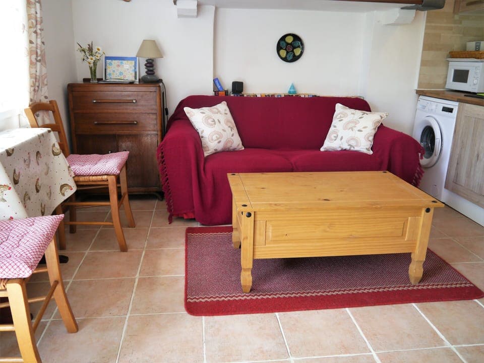 living room area with drop leaf dining table