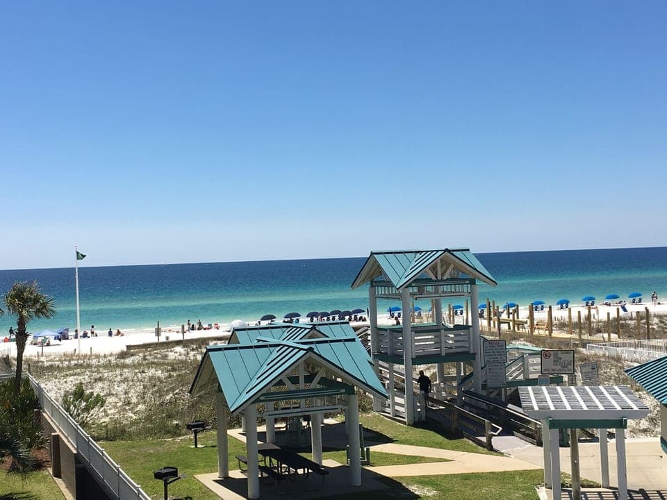 WEST FACING VIEW OF BEACH TAKEN BY ME FROM THE LARGE BALCONY. SEATS 6.
