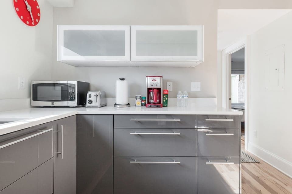 kitchen amenities include regular drip coffee, with filters, coffee, creamers, paper towels, toaster and microwave, as well as a full fridge, stove and oven. 