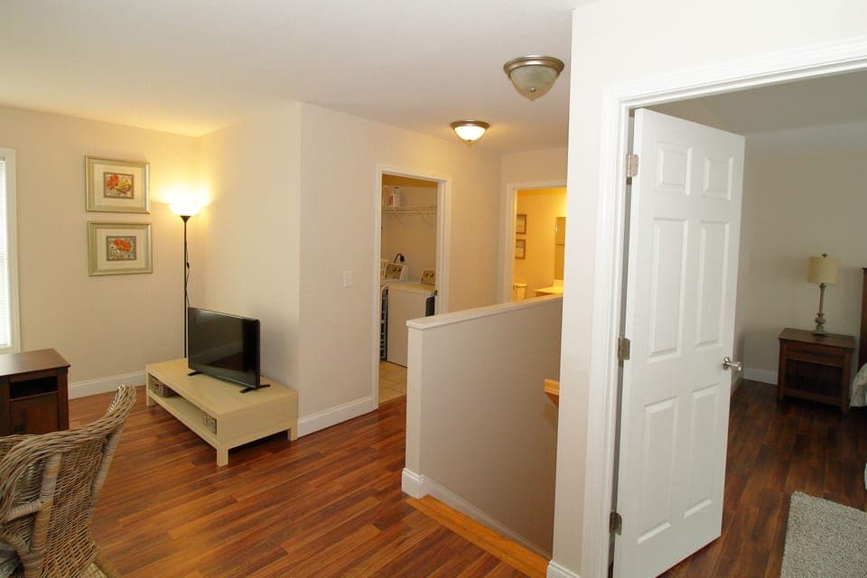 Second floor showing queen bedroom, living room, laundry & full bathroom