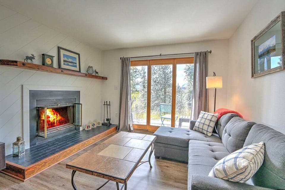 Living room with fireplace and walk out back porch