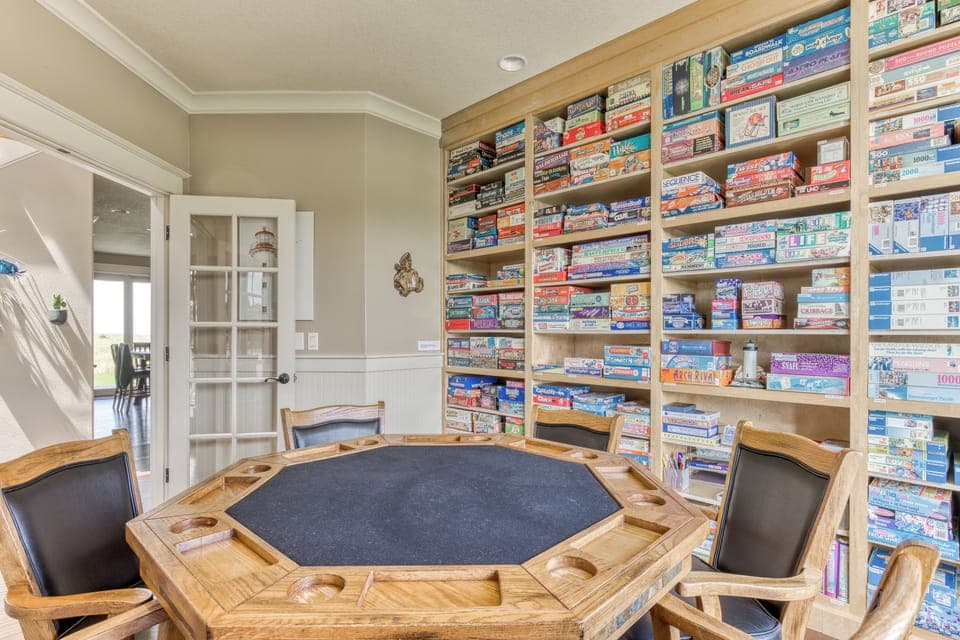 Play games on the hardwood game table with six padded swivel chairs