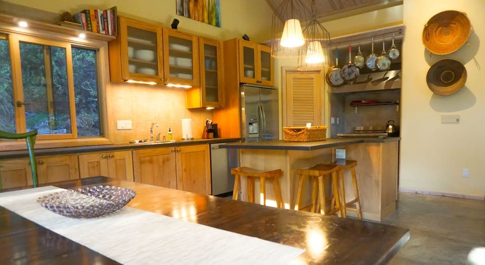 The kitchen in the main house offers an open layout and is well stocked