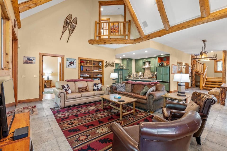 Living area with door to first master bedroom