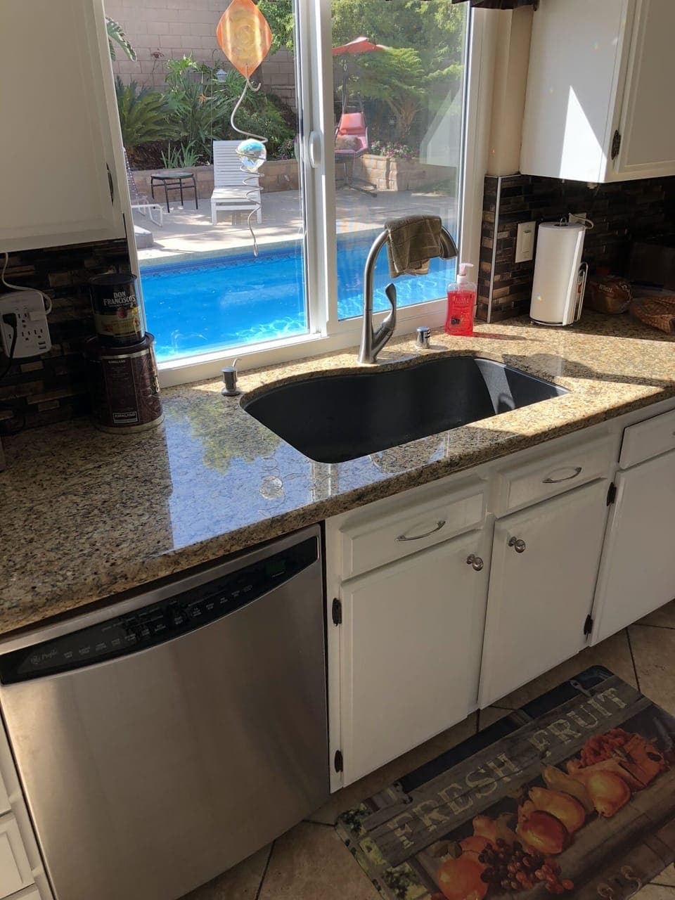 New granite countertops with glass backsplash large composite sink Ninja blender