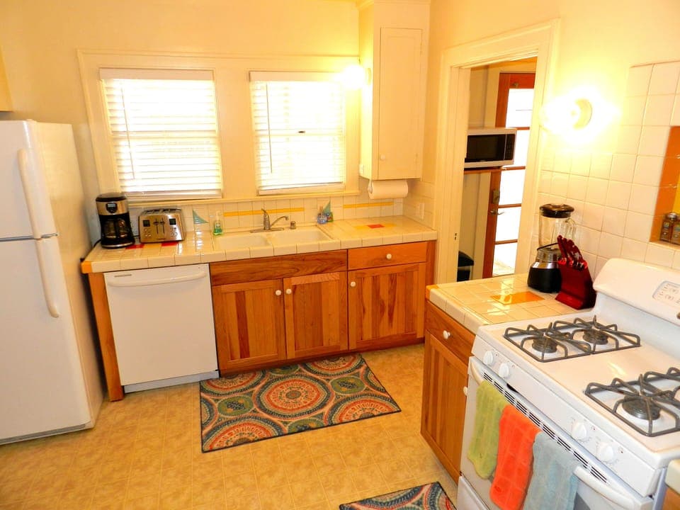 Kitchen. Remodeled. Fully stocked with supplies & basic spices, plates, utensils