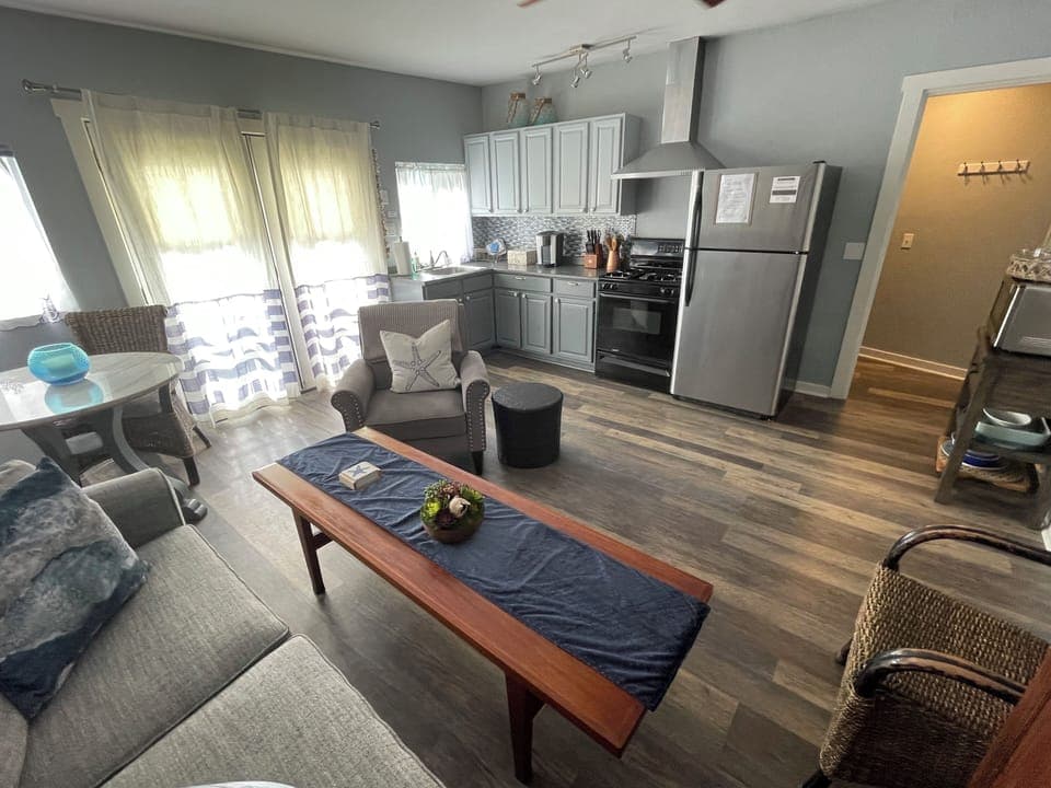 Main living with full kitchen. Private courtyard with coastal breeze invites.