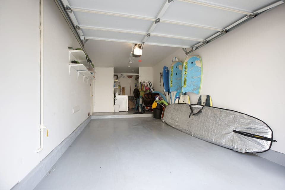 Garage w/alot Toys, surf board, boogie boards , umbrellas and chairs, stroller.