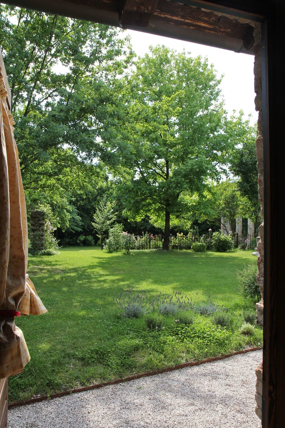 View from the bedroom of Casa Artuico on its private fenced garden