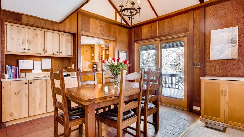 Dining room with sliding glass door out to deck.