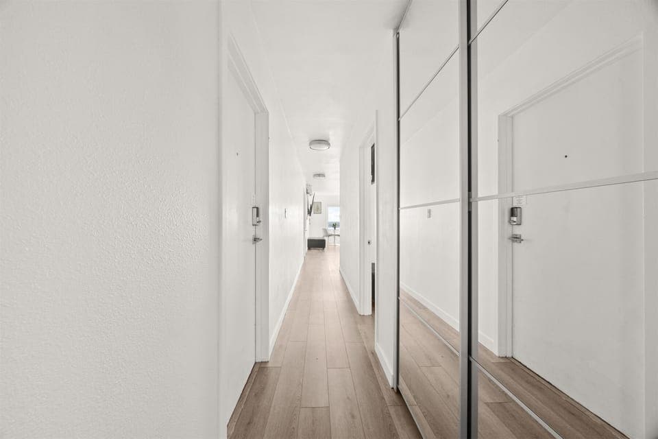 Mirrored custom closet & storage in beautiful hallway