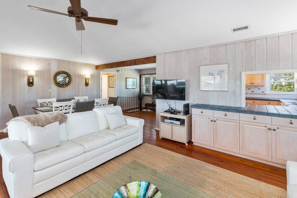 Living Room has a pass thru to the Kitchen and a Smart TV