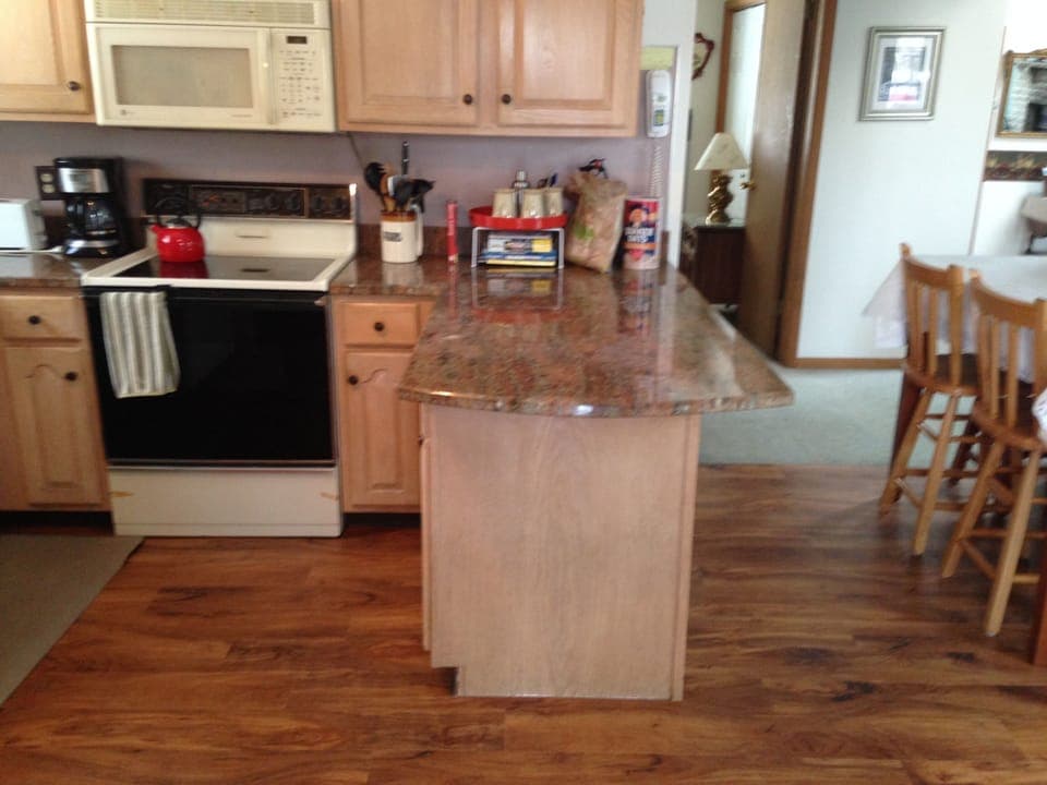 Queen-size bedroom on first floor is near kitchen and has its own bathroom