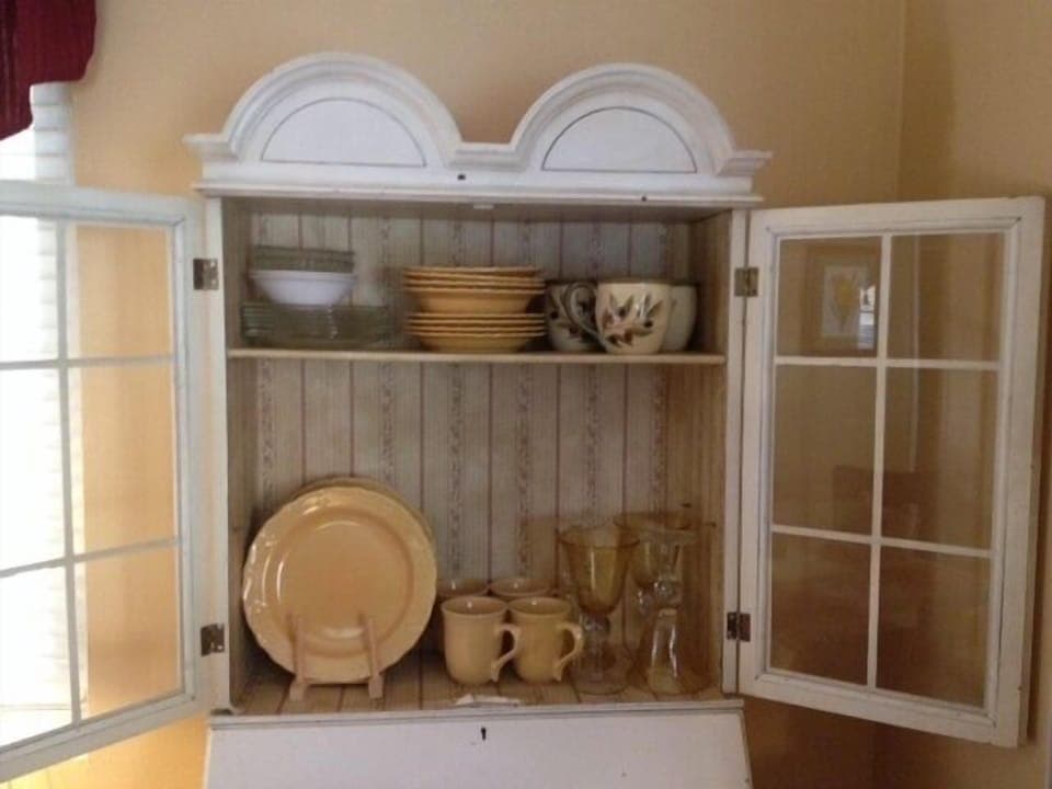 Charming dinnerware, plus champagne glasses & entertaining ware in other cabinet