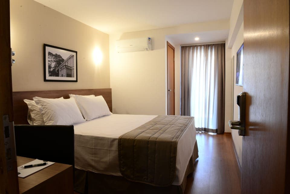 Double Room | Minibar, in-room safe, desk, blackout drapes