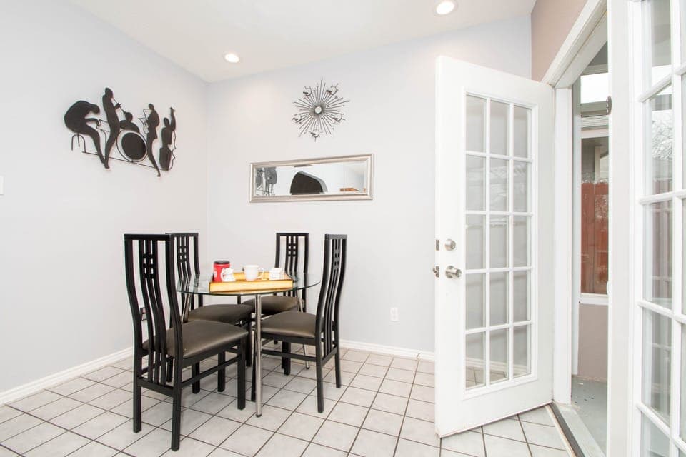 Dining room is open to sunroom, kitchen and living room