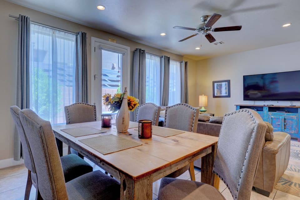 Beautiful dining and seating area. Lots of natural light & access to back patio