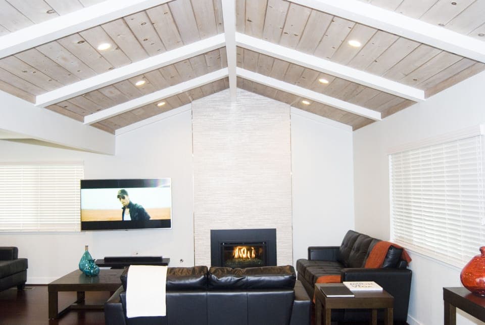 Living room with fireplace and 65" 4K SmartTV