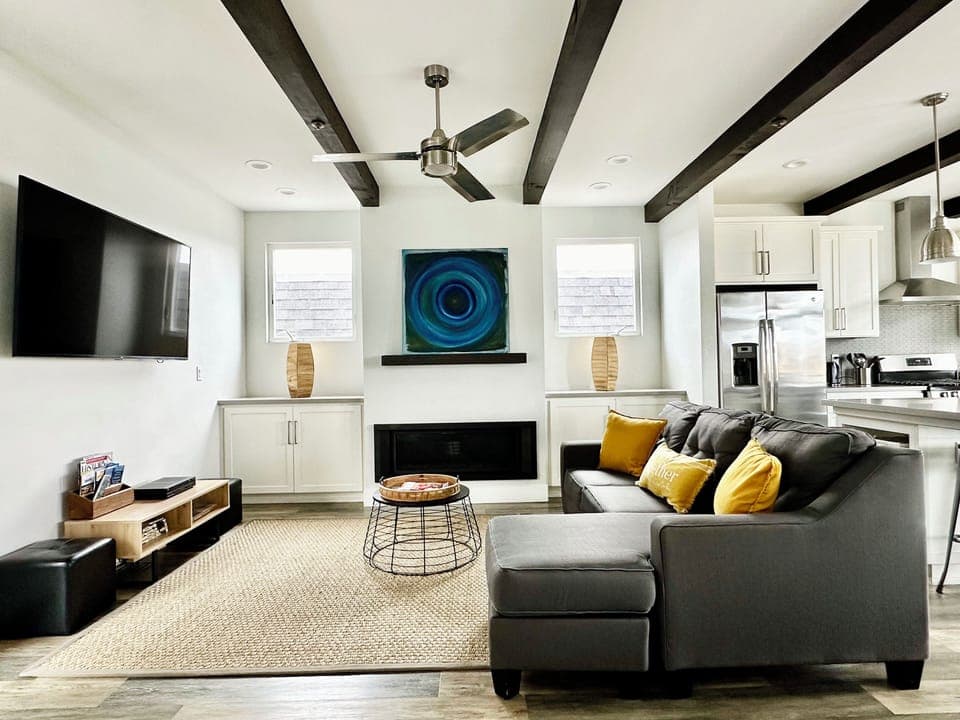 Living area with a gas fireplace and Sofa (Queen) Bed.