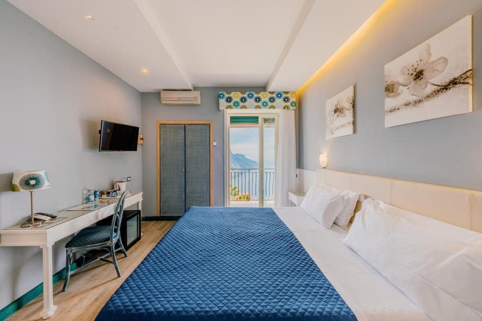 Large Deluxe Double Room, Sea View | Premium bedding, minibar, desk, laptop workspace