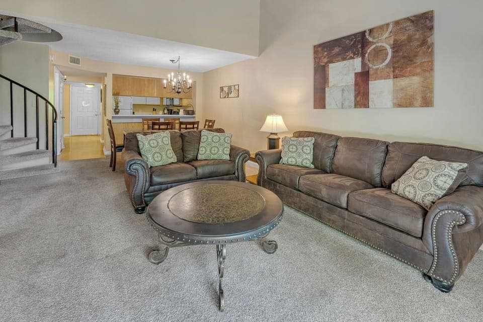 large living area with sprial staircase to upstairs bedroom