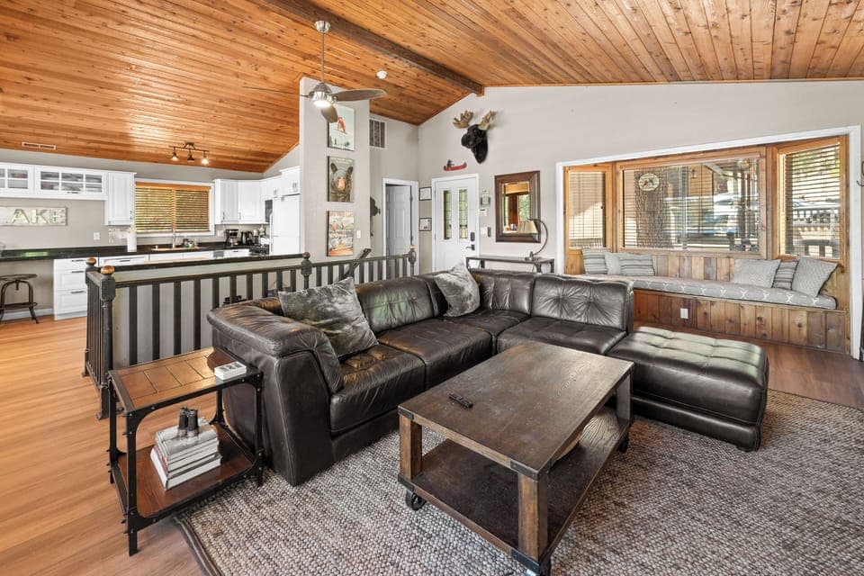 Living Room - Living Room with vaulted ceilings, TV, couches, and open floor plan