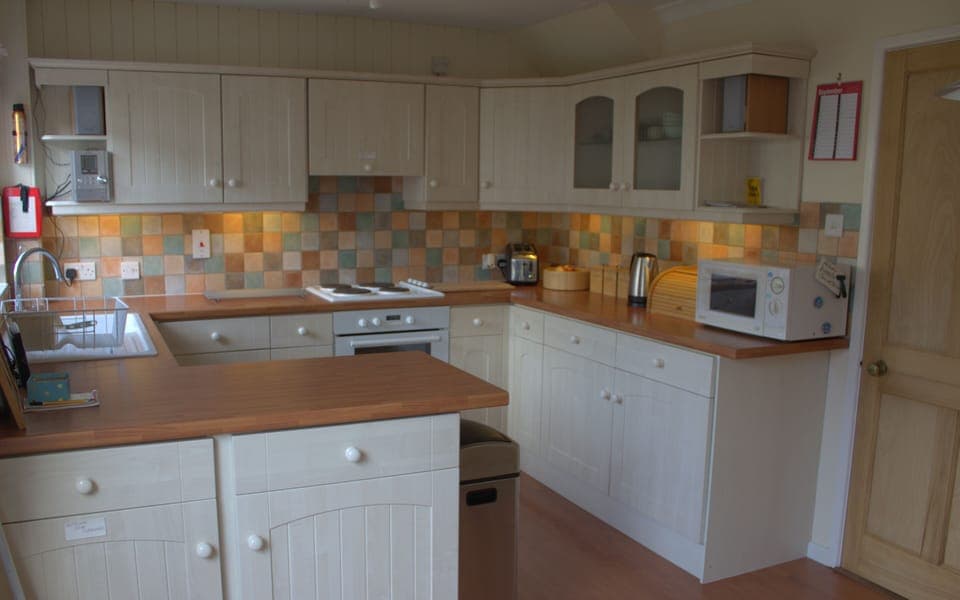 Modern kitchen with inetgrated fridge, freezer, dishwasher and washing machine