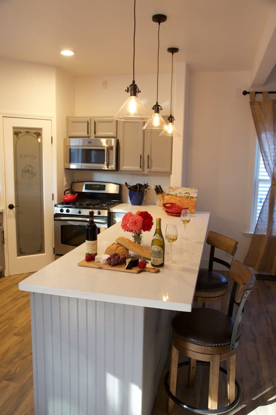 Stocked Kitchen, Gas Range, pantry, Microwave, seats 4 with Counter Top Stools.