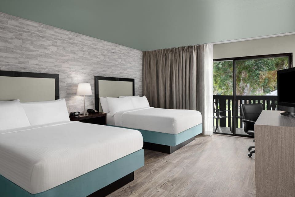 Deluxe Room, 2 Queen Beds, Balcony, Courtyard View | Hypo-allergenic bedding, in-room safe, desk, laptop workspace