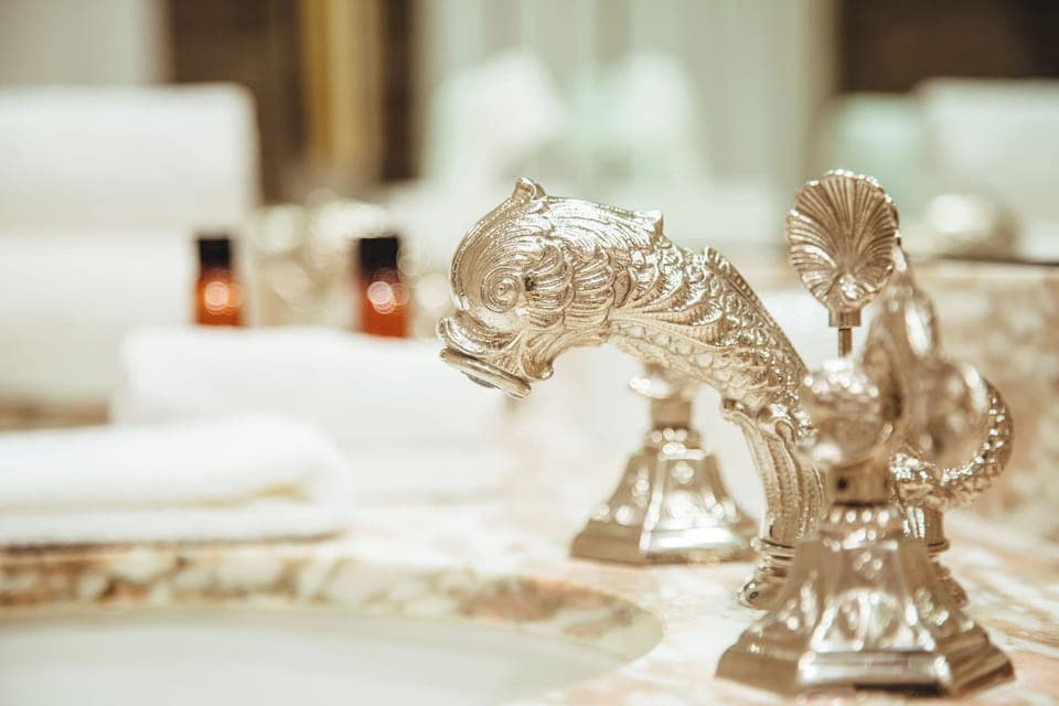 Combined shower/tub, designer toiletries, hair dryer, bathrobes