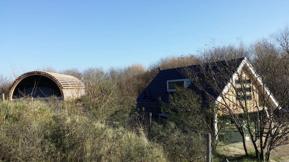 Sauna on the hill and the holiday home sheltered within the dune slack