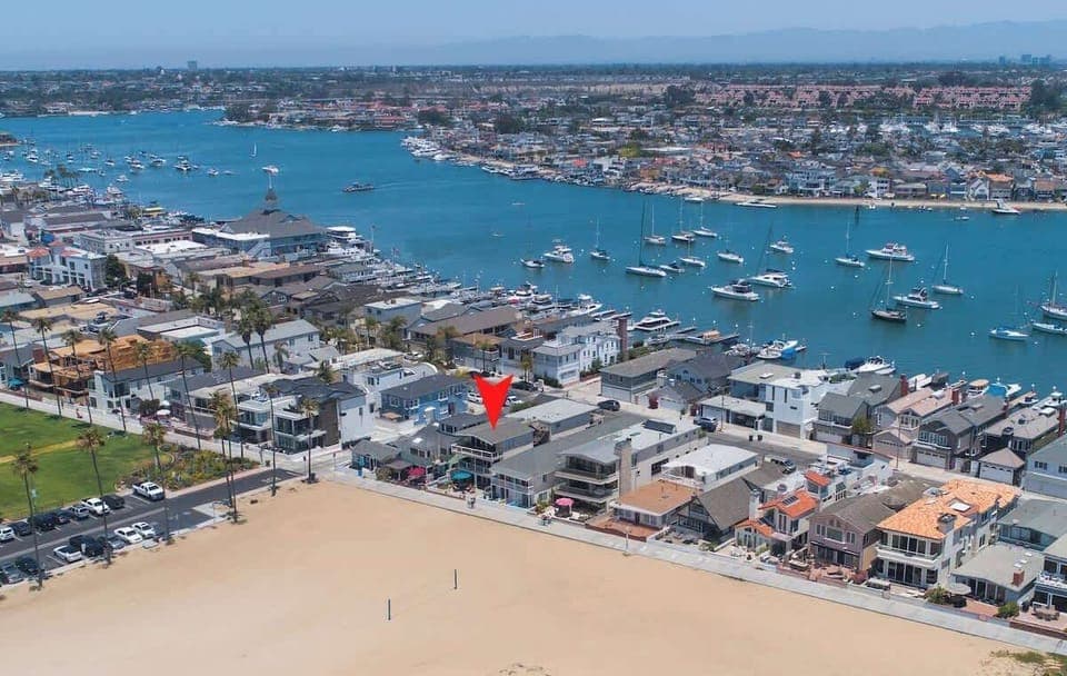 Aerial view of area with pinpoint of home