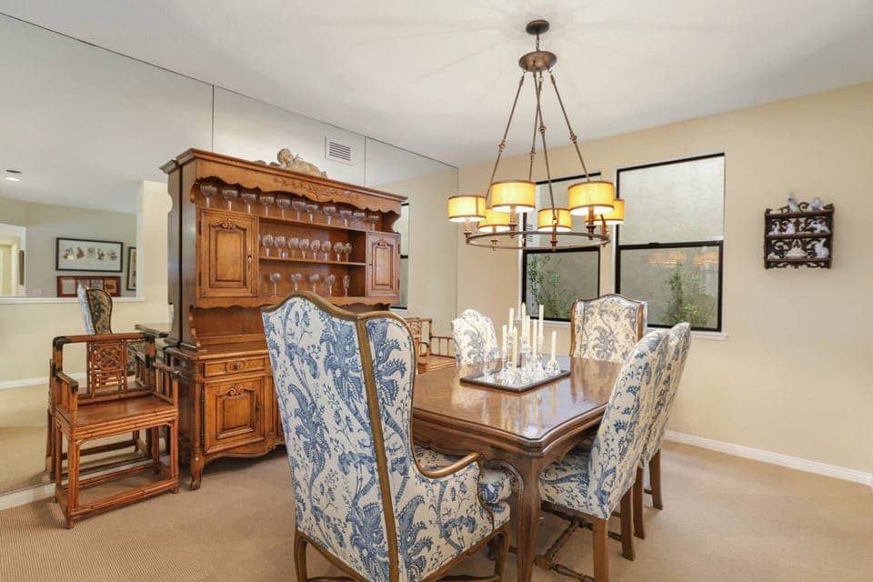 The dining room is in between the kitchen and the living room, so no one misses any of the action.