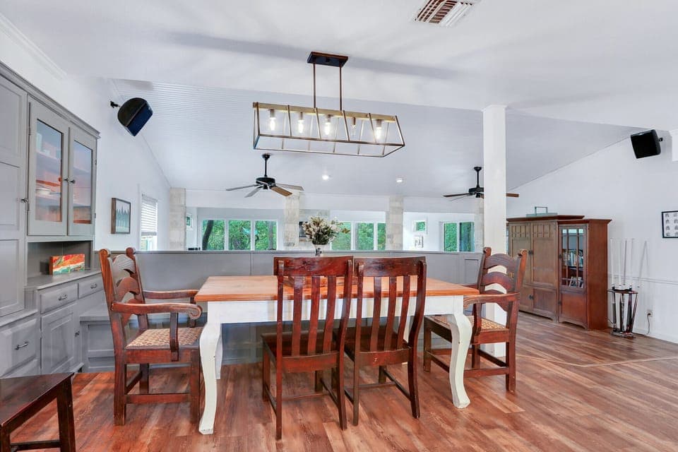 View of the dining area as you walk out from the laundry room moving toward the living room.
