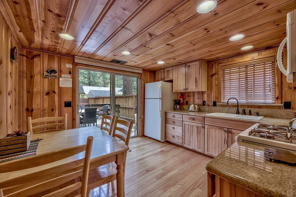 Cook up a delicious meal in the kitchen with refrigerator, sink, oven/stove, microwave--or step through the sliding door to the back deck with BBQ