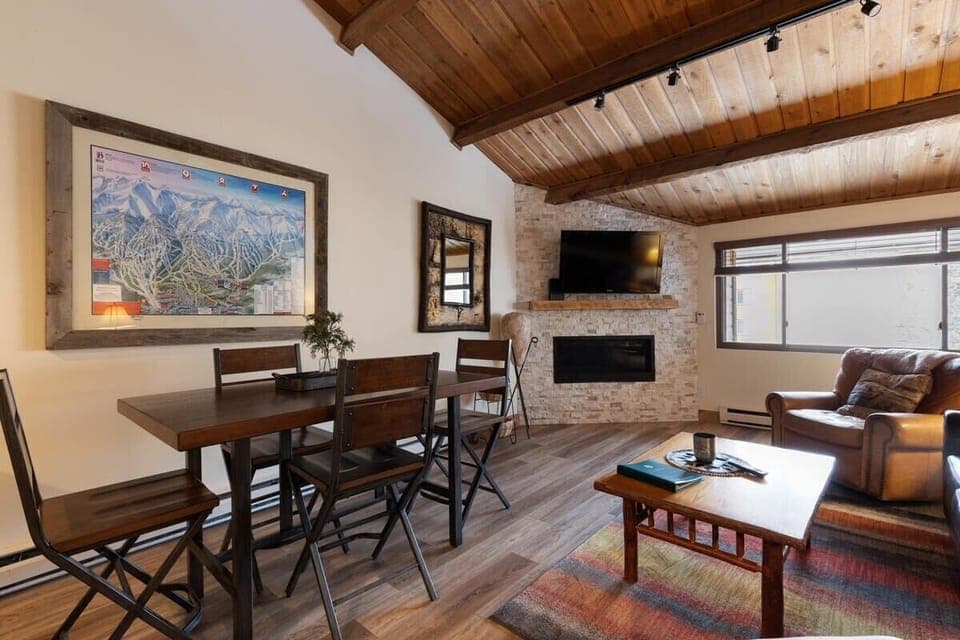 Living area with fireplace, flat screen TV and seating for 4